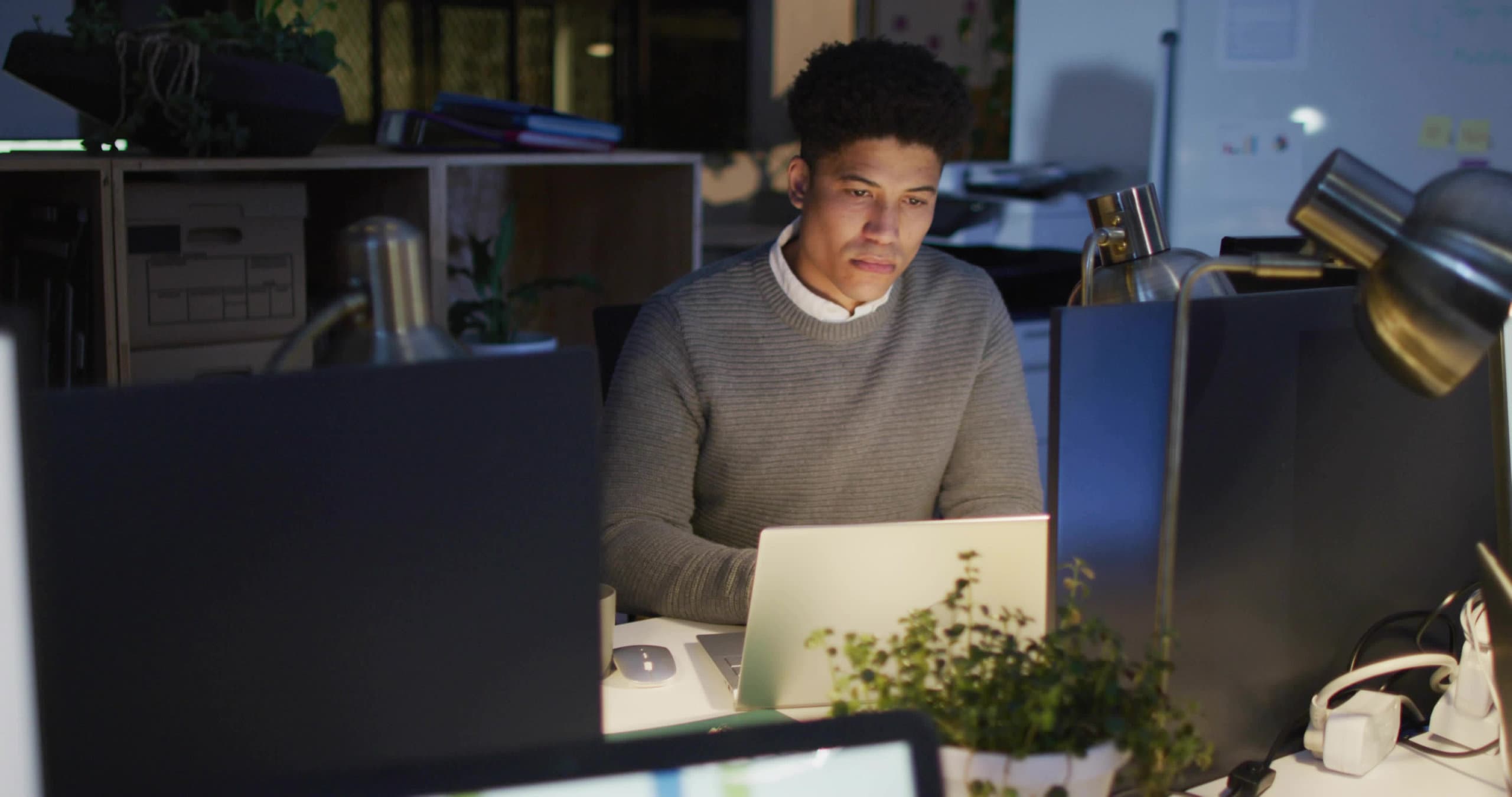 Man sitting at a desk working on his computer